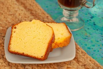 breakfast black coffee and poundcake on table 