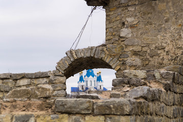 St. George's Cathedral is visible through the embrasure of the fortress in Kamenetz-Podolsky,...