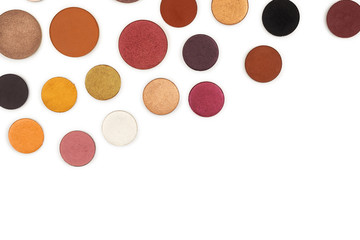 Round multicolored make up eyeshadows isolated on white.