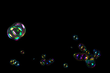 Soap bubbles isolated on a black background.