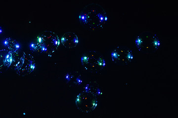 Soap bubbles isolated on a black background. Copy space.