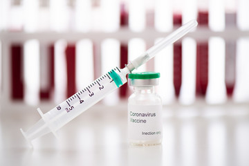 Test tubes with blood sample Covid-19 coronavirus. Vaccine and syringe injection It use for prevention, immunization and treatment from COVID