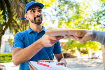 Delivery man making home delivery to customer.