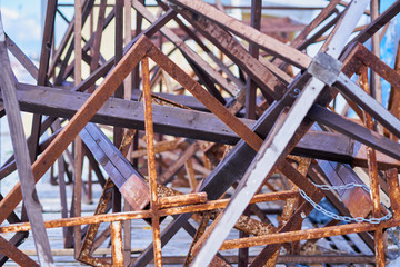 Chaotic wooden planks and metal structures. Abstract background.