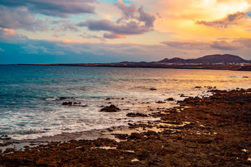 sunset with big clouds from the beach