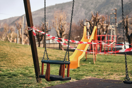 proibidden child swing on a urban pubblic park due to the coronavirus, covid-19 lockdown 