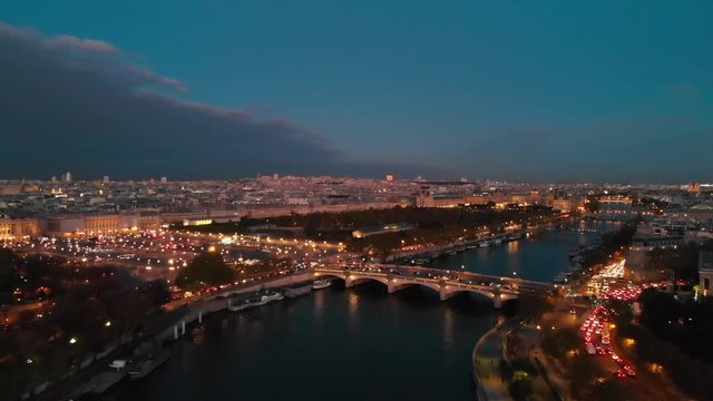 Establishing aerial view of Paris Place de la Concorde Paris Tuileries Garden park and Paris Seine River at night