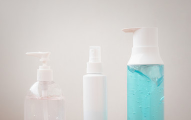 Alcohol gel in bottles for killing the Covid virus 2019. Concept for protecting yourself from germs.