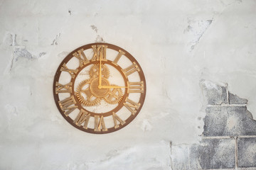 Old clock on the cement ground