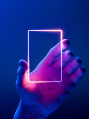 Hand Holding Vertical Neon Frame. Hand Illuminated by Pink, Violet and Blue Neon Lights. 3d rendering - obrazy, fototapety, plakaty