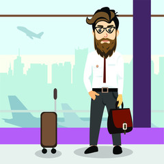 Businessman at the airport with a suitcase waiting for his flight. Hipster character with beard and mustache on a business trip