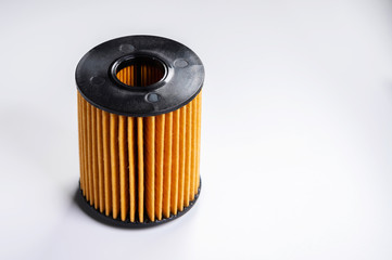 Replaceable cartridge fuel system. New fuel filter element on a gray gradient background