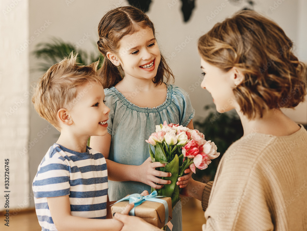 Poster happy children giving gift an flowers to mother.