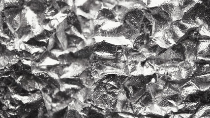 Aluminum crumpled foil, Pattern background with high-resolution design for book cover or brochure, poster, wallpaper or realistic business. Silver texture background, polished metal steel
