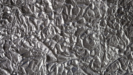 Aluminum crumpled foil, Pattern background with high-resolution design for book cover or brochure, poster, wallpaper or realistic business. Silver texture background, polished metal steel