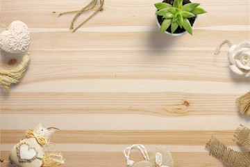 Composition with decoration objects on wooden desk and free space in the centre as template for hero header images