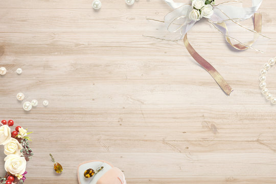 Composition with decoration wedding objects on wooden desk and free space in the centre as template for hero header images