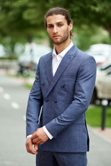 Attractive bearded young man in classic suit. Elegancy and male