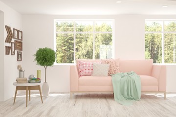 White living room with sofa and summer landscape in window. Scandinavian interior design. 3D illustration