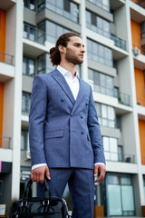 Attractive bearded young man in classic suit. Elegancy and male