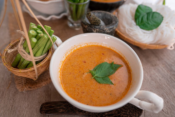 classic Thai food culture menu call Kanom Jeen or red curry with soft noodle 