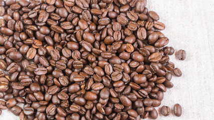 coffee beans.coffee beans sprinkled on fabric.