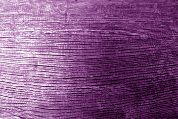 Weathered wooden board texture in purple tone.