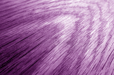 Wooden board texture with blur effect in purple tone.