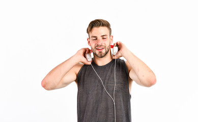 Listen music for motivation and inspiration. Audio quality. Man handsome unshaven hipster listening...