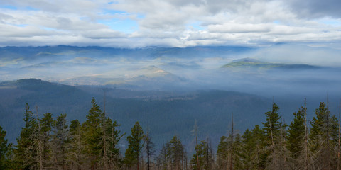 Misty mountain landscape. Panoramic view from Green Ridge Lookout in Central Oregon.