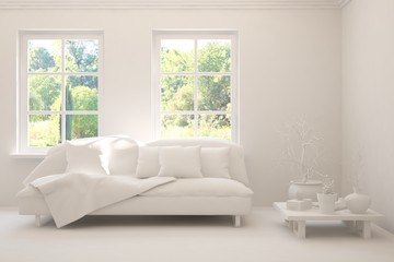 White living room with sofa and summer landscape in window. Scandinavian interior design. 3D illustration