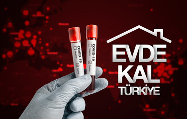 Pandemic COVID-19 concept: Scientist holding blood sample in test tubes with positive result.  Stay...