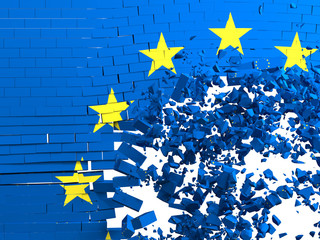 brick wall with the European flag that is destroyed