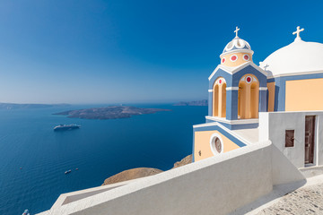 Beautiful church in Santorini, Greece with sea view in the background. Summer travel and vacation landscape. Amazing holiday destination concept