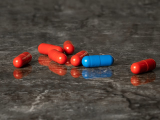 heap of red pills and one blue on the marble table
