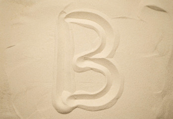 Obraz premium letters of the English alphabet drawn in the sand