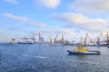 Tugboat sailing in port in winter