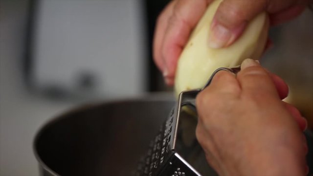 Grating a potato