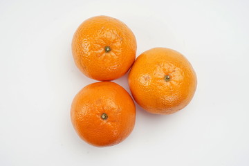 Ripe oranges isolated on a light background