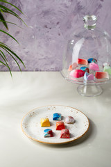Modern chocolate candy on white plate
