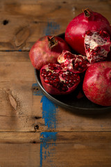 Close up of pomegranates on rustic boards