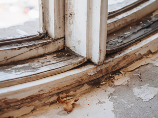 Old dirt rotten wooden retro white window