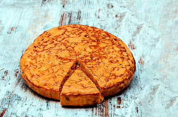 Spanish omelette surrounded by rustic background