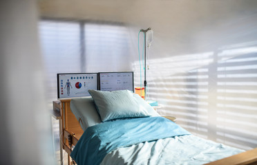 Empty bed in hospital room, coronavirus concept.