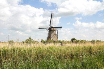 Kinderdijk, Rotterdam,  Netherlands rural lanscape with windmills at famous tourist site Kinderdijk in Holland. Old Dutch village Kinderdijk, UNESCO world heritage site.