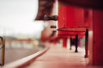 Closeup photo of red prayer wheels in buddhist temple. Religion concept