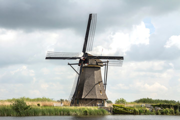 Netherlands rural lanscape with windmills at famous tourist site Kinderdijk, Rotterdam, in Holland. Old Dutch village Kinderdijk, UNESCO world heritage site.