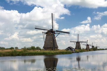 Kinderdijk, Rotterdam, NETHERLANDS: Netherlands rural lanscape with windmills at famous tourist site Kinderdijk in Holland. Old Dutch village Kinderdijk, UNESCO world heritage site.	