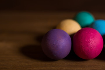 colorful easter eggs on wooden background