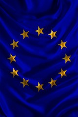 vertical silk national flag of modern EU states with beautiful folds, concept of tourism, travel, emigration, global business